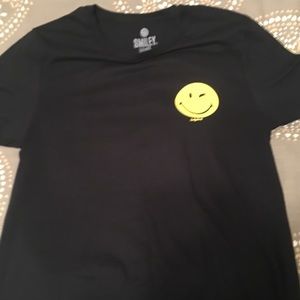 Men’s black Smiley World tee with smiley face logo